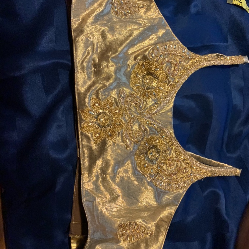 Lehenga gold and peach /pink intricately designed